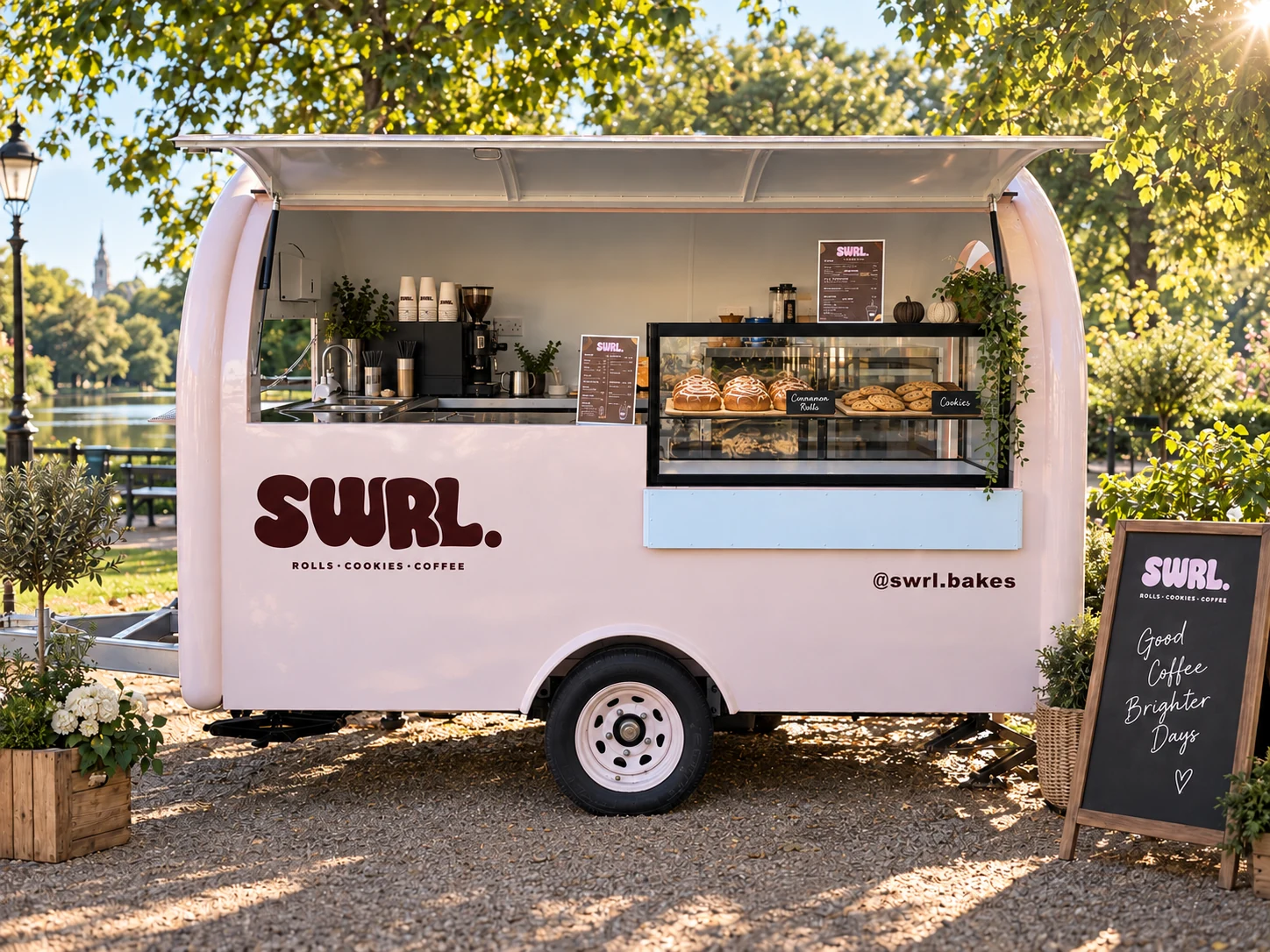 The pink SWRL truck with its serving hatch open, coffee counter and bakes on display
